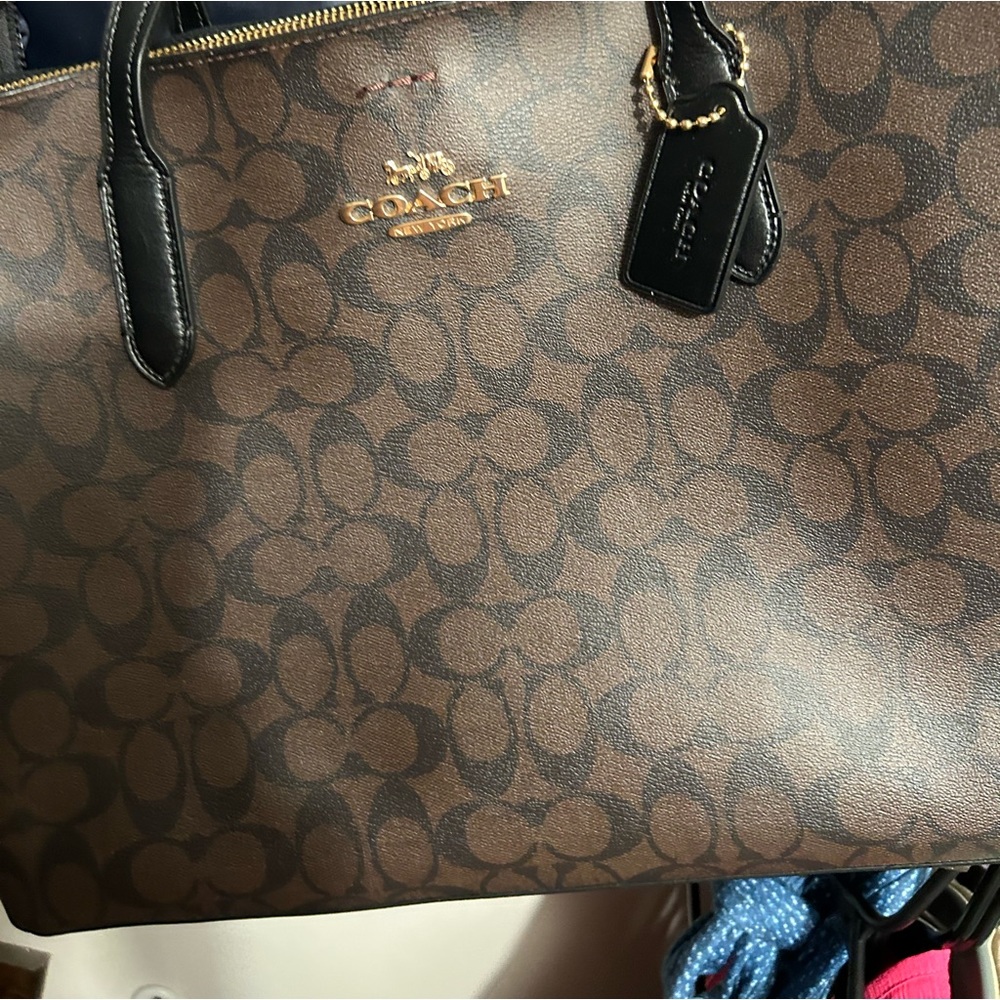 Authentic coach handbag and lap top holder can also be used as book bag!